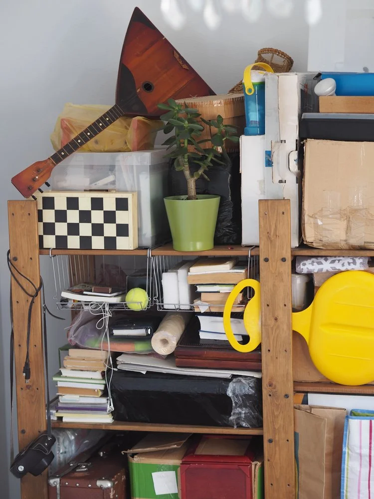 Cluttered shelf with a random assortment of goods